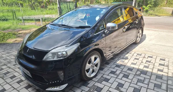 Toyota Prius with driver